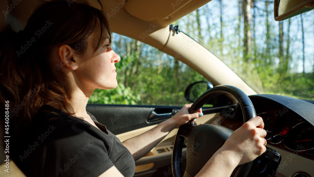 The woman driving the modern car The woman driving the modern car