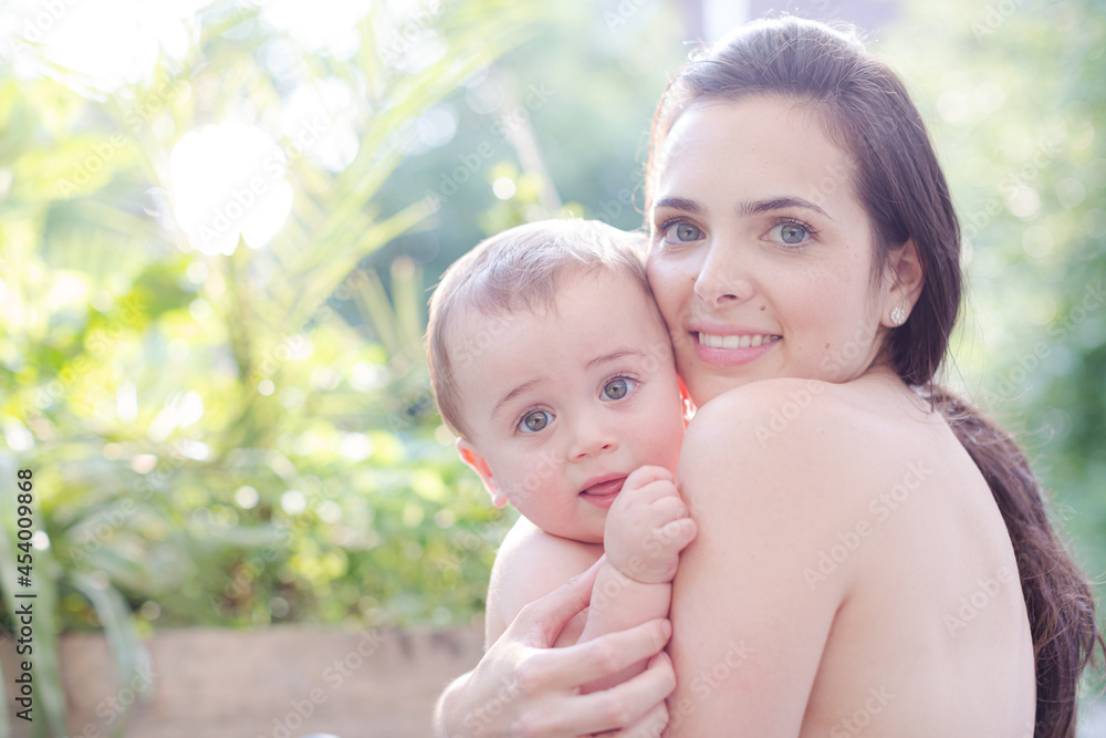 Mother holding baby boy outdoors Mother holding baby boy outdoors