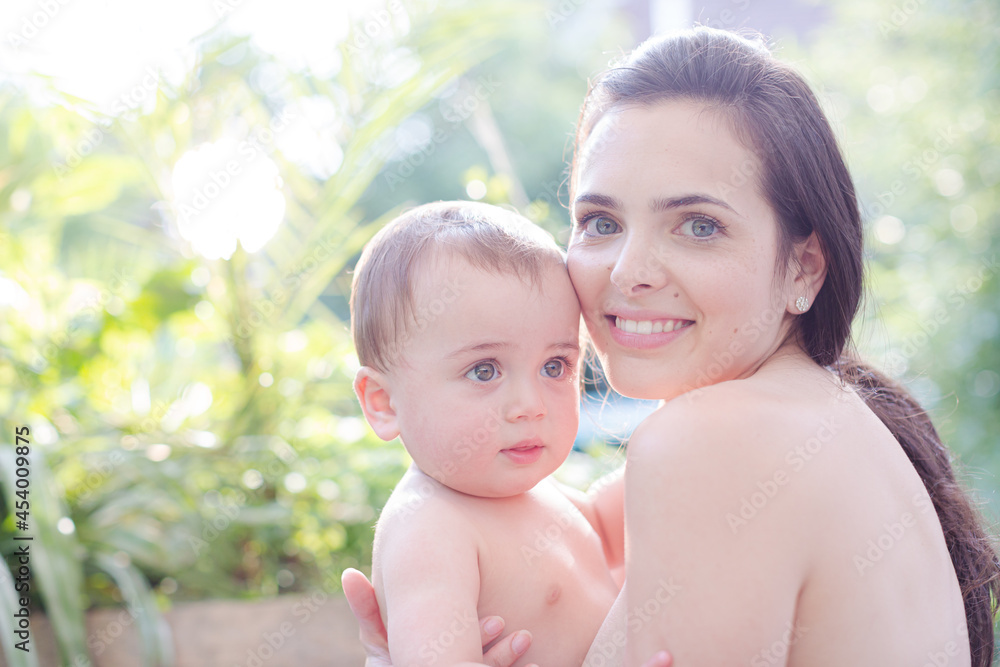 Mother holding baby boy outdoors Mother holding baby boy outdoors