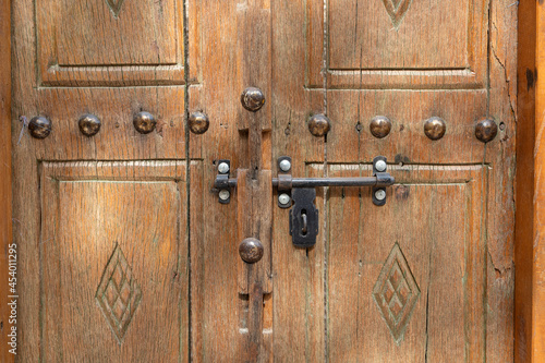 An old wooden door with metallic bolt, close up, from Arabia
