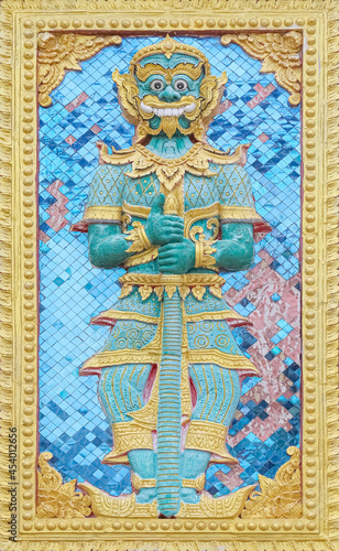 The high-relief sculpture of a giant on the temple wall thai style at Sri Don Mun Temple, Chiang Mai, Thailand