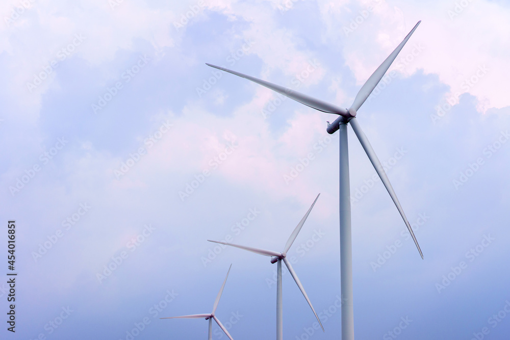 Wind turbine renewable energy source summer in forest mountains landscape energy transmission distribution equipment in natural environment