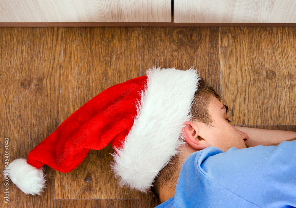 Young Man sleep in Santa Hat Young Man sleep in Santa Hat