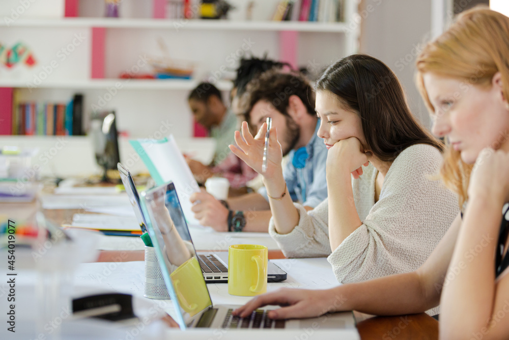 People working at conference table in office People working at conference table in office
