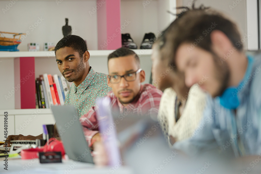 People working at conference table in office People working at conference table in office
