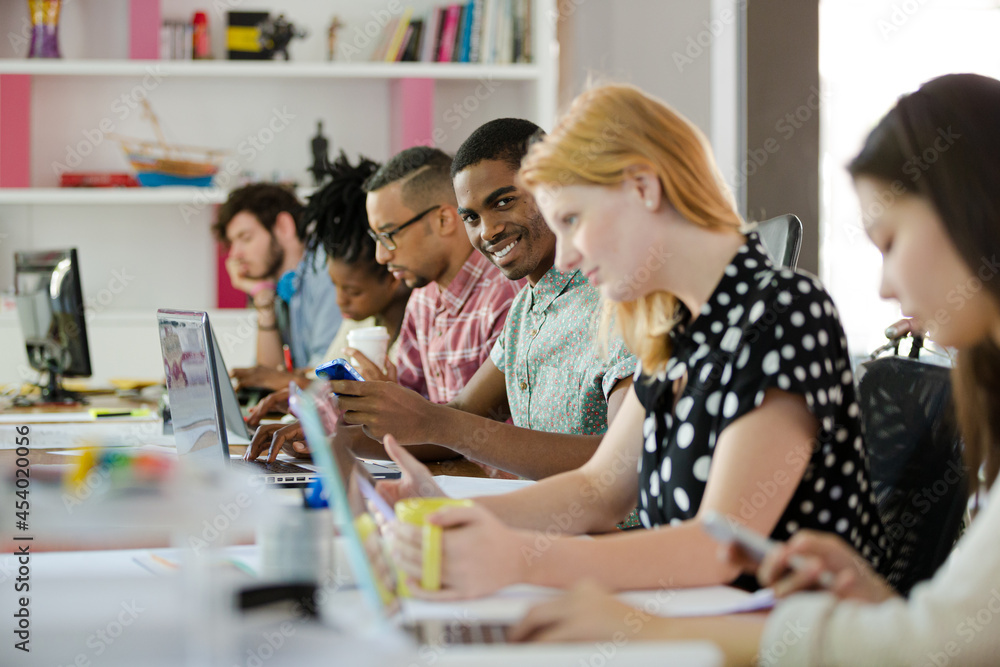 People working at conference table in office People working at conference table in office