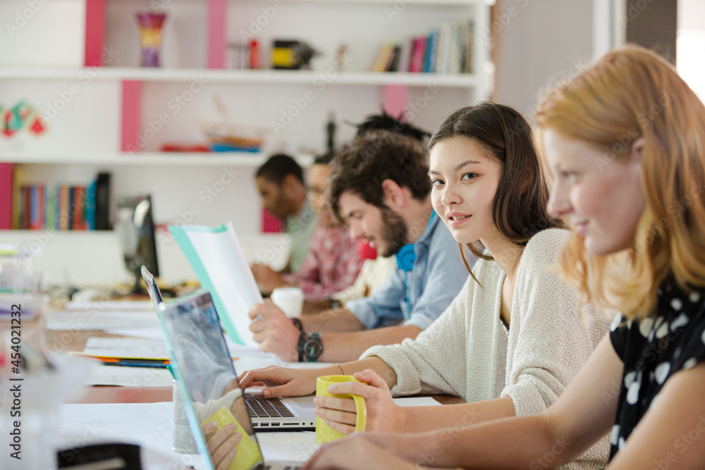 People working at conference table in office People working at conference table in office