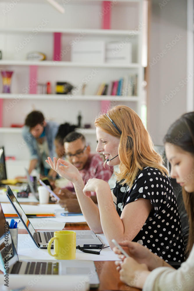 People working at conference table in office People working at conference table in office