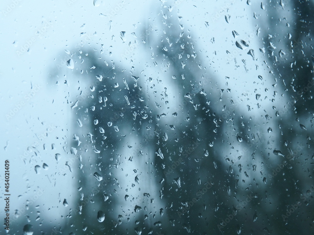 Raindrops on the window. Rainy and gray day. Weather forecast. Sad and depressed mood