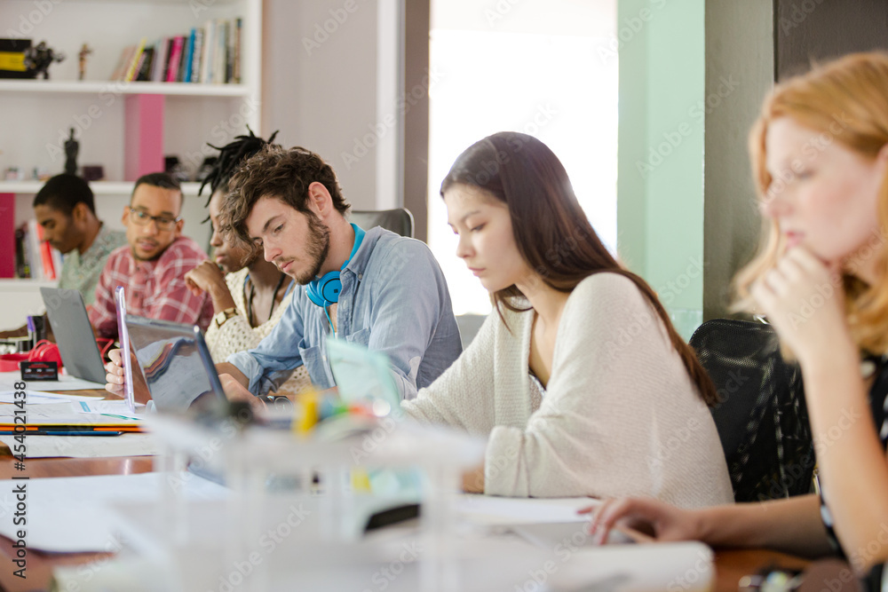 People working at conference table in office People working at conference table in office