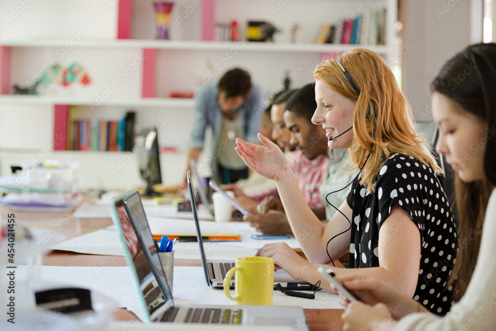 People working at conference table in office People working at conference table in office