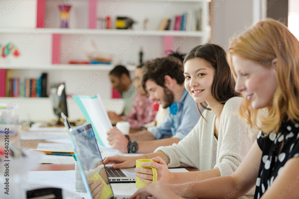 People working at conference table in office People working at conference table in office