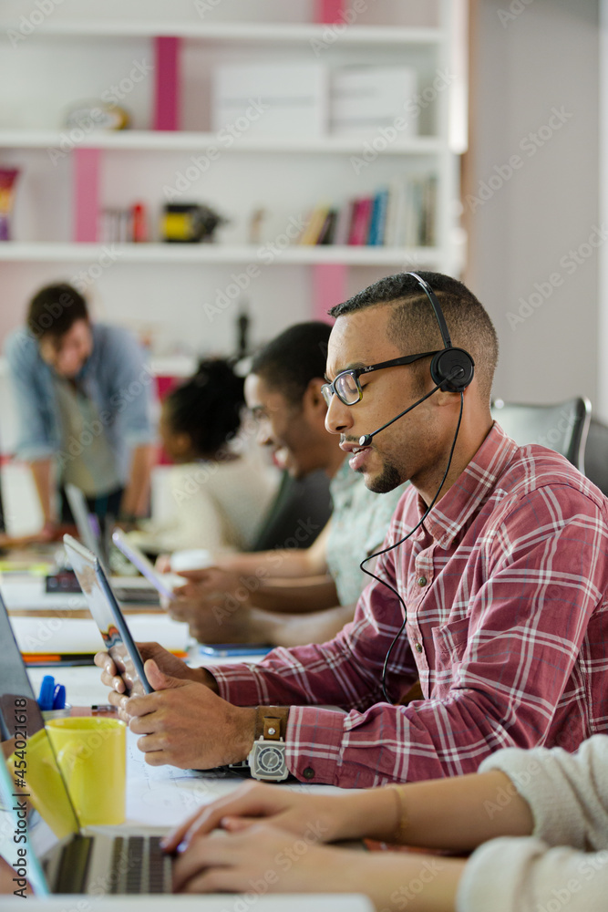 People working at conference table in office People working at conference table in office