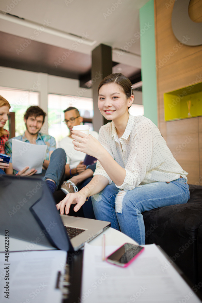 Fototapeta premium Woman drinking coffee in office
