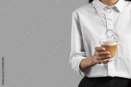 Woman in white shirt holdin...