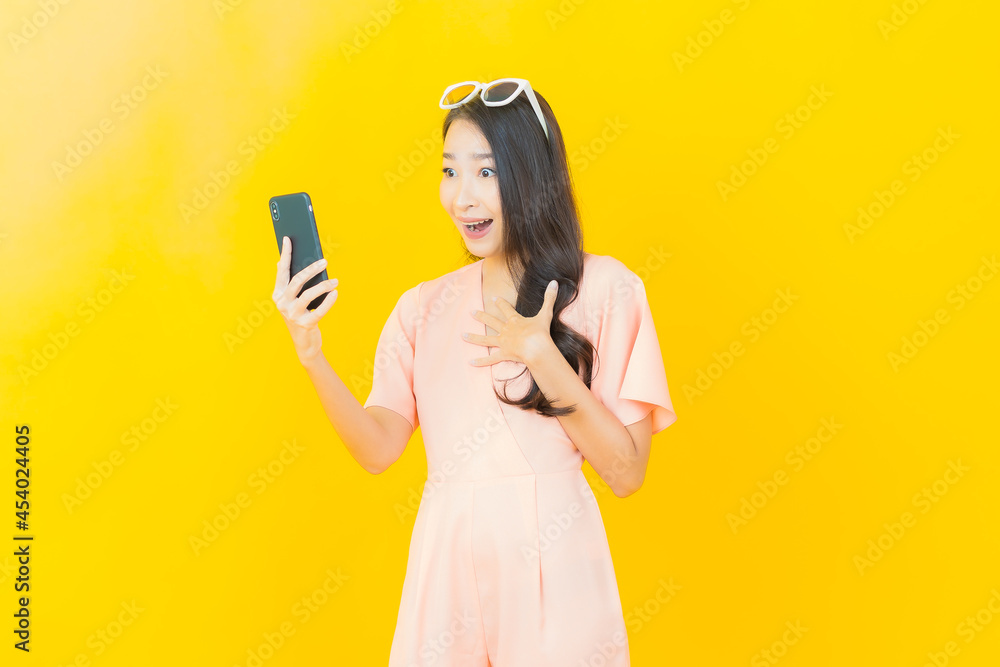 Portrait beautiful young asian woman smile with smart mobile phone Portrait beautiful young asian woman smile with smart mobile phone