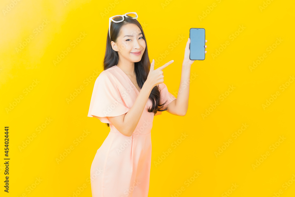 Portrait beautiful young asian woman smile with smart mobile phone Portrait beautiful young asian woman smile with smart mobile phone