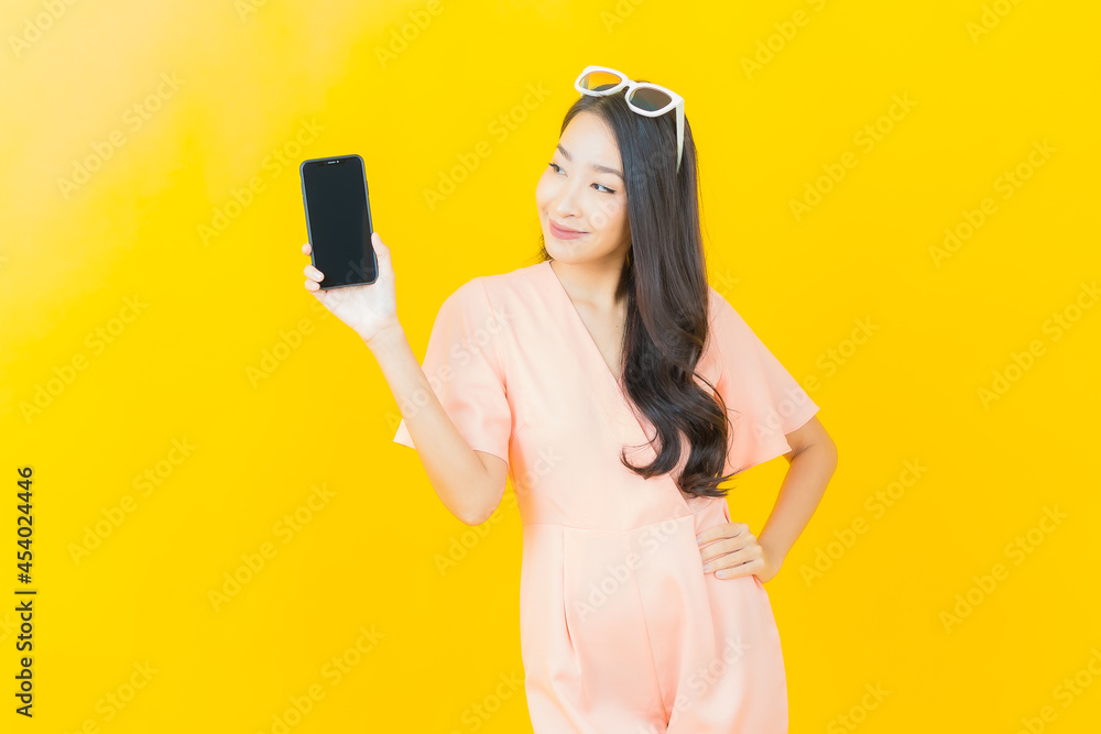 Portrait beautiful young asian woman smile with smart mobile phone Portrait beautiful young asian woman smile with smart mobile phone