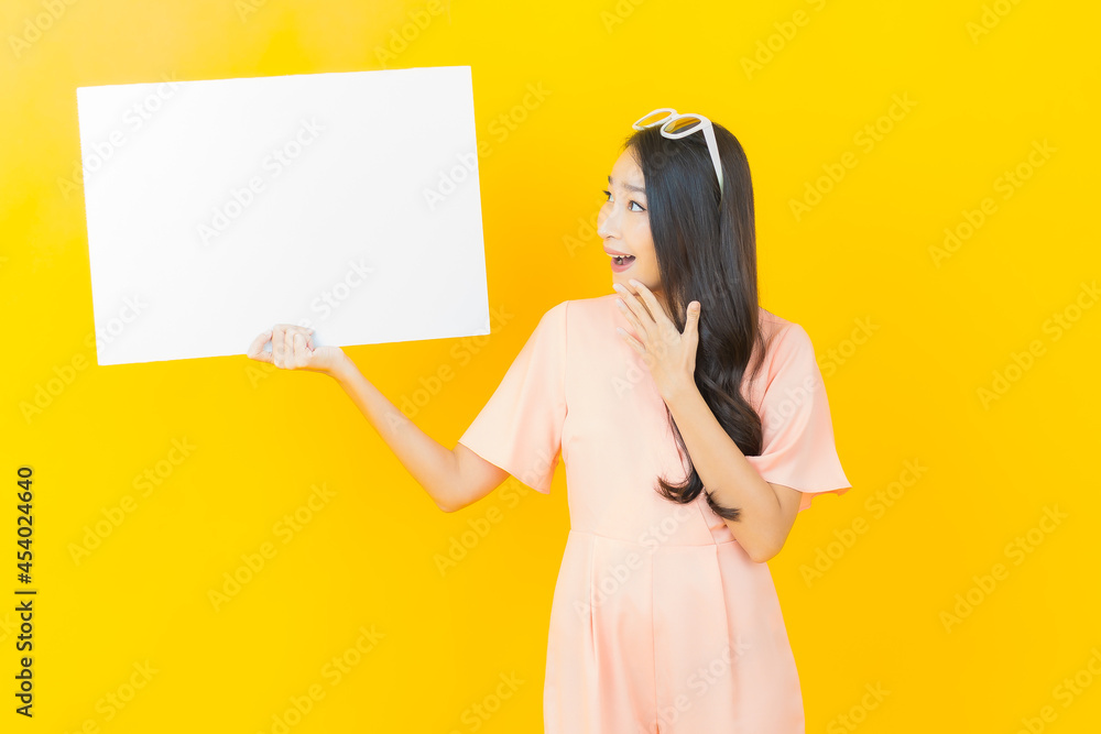 Portrait beautiful young asian woman with empty white billboard
