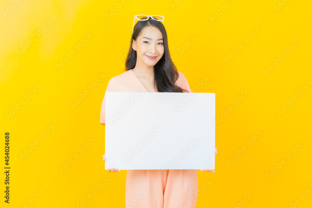 Portrait beautiful young asian woman with empty white billboard Portrait beautiful young asian woman with empty white billboard