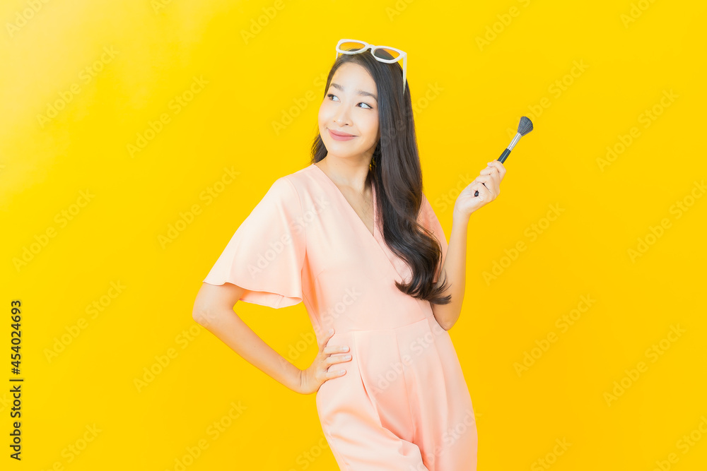 Portrait beautiful young asian woman with make up brush cosmetic Portrait beautiful young asian woman with make up brush cosmetic
