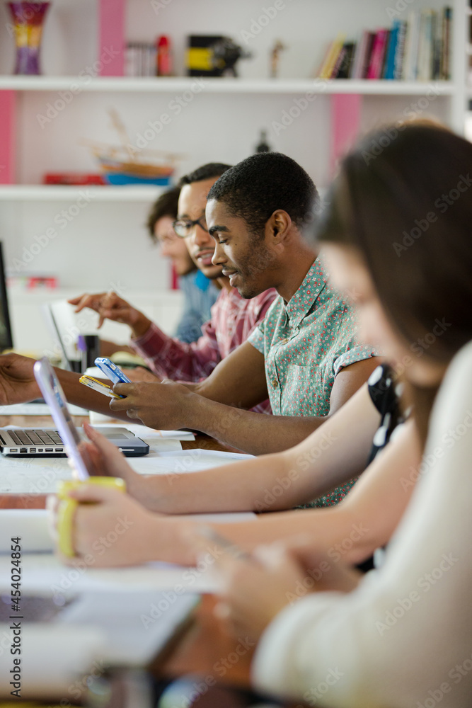 People working at conference table in office People working at conference table in office
