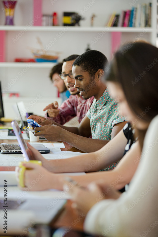 People working at conference table in office People working at conference table in office