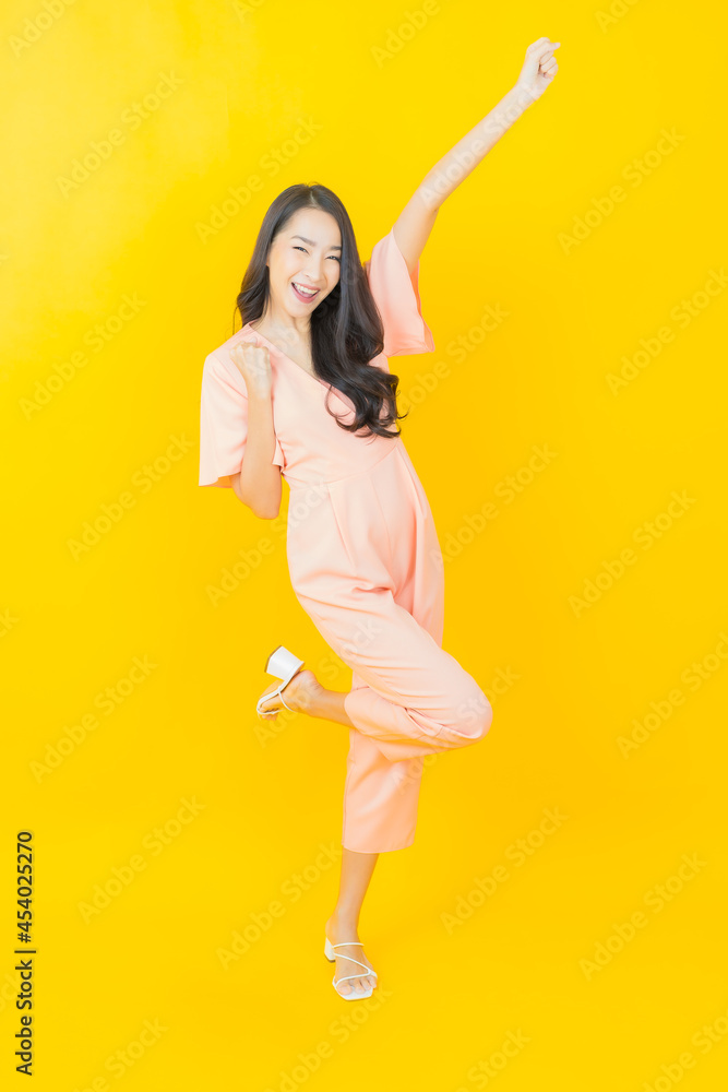 Portrait beautiful young asian woman smile with action Portrait beautiful young asian woman smile with action