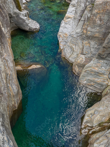 Verzasca Riverbed with clear emerald green water in Canyon with clear turquoise water