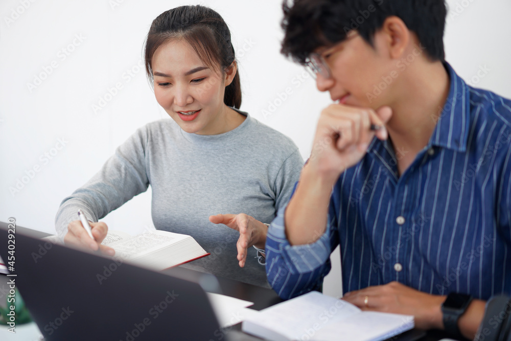 Office work concept a pretty businesswoman asking for an idea about the marketing strategies from her business partner Office work concept a pretty businesswoman asking for an idea about the marketing strategies from her business partner