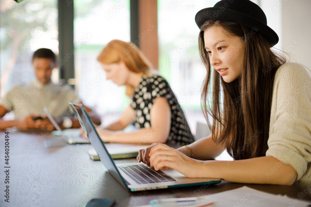 People working at conference table in office People working at conference table in office