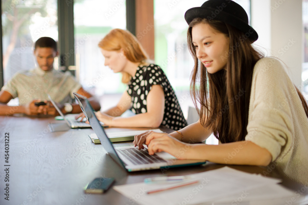 People working at conference table in office People working at conference table in office