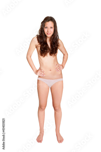 Full length portrait of a smiling brunette woman wearing white panties, her private parts are not visible, isolated in front of white studio background