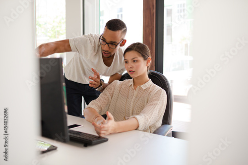 People working on laptop in office