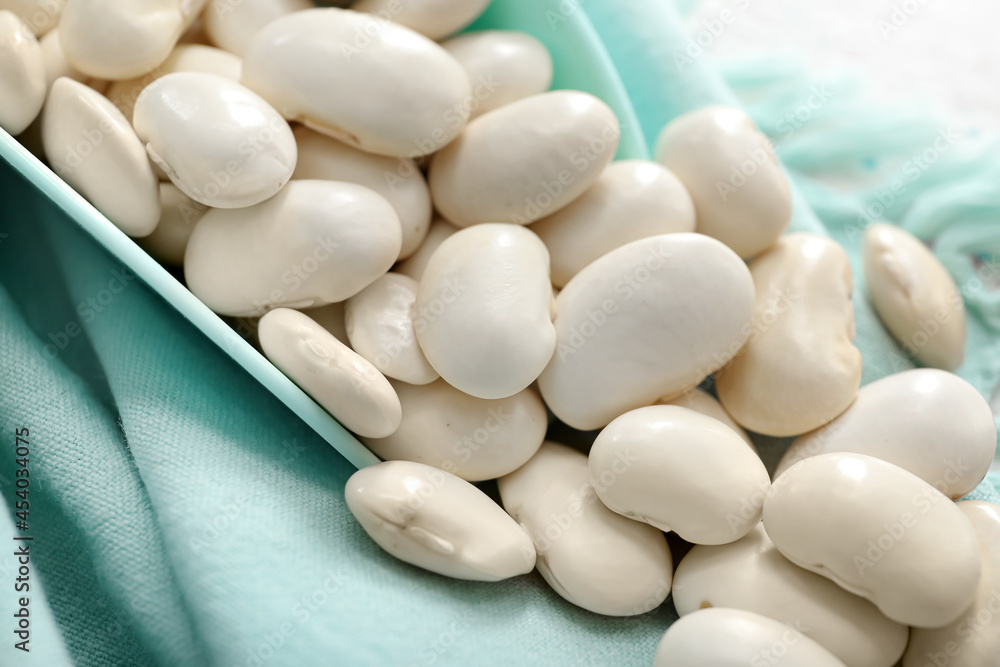 Raw beans on fabric background, closeup Raw beans on fabric background, closeup