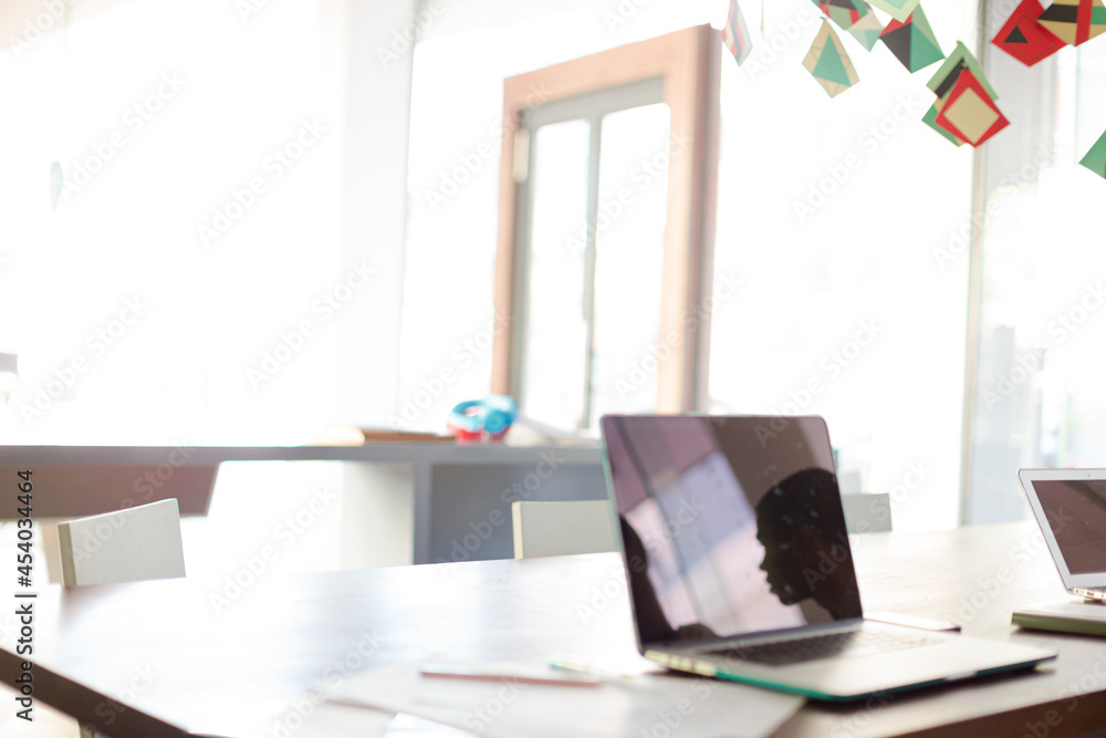 Laptop on conference table in office Laptop on conference table in office
