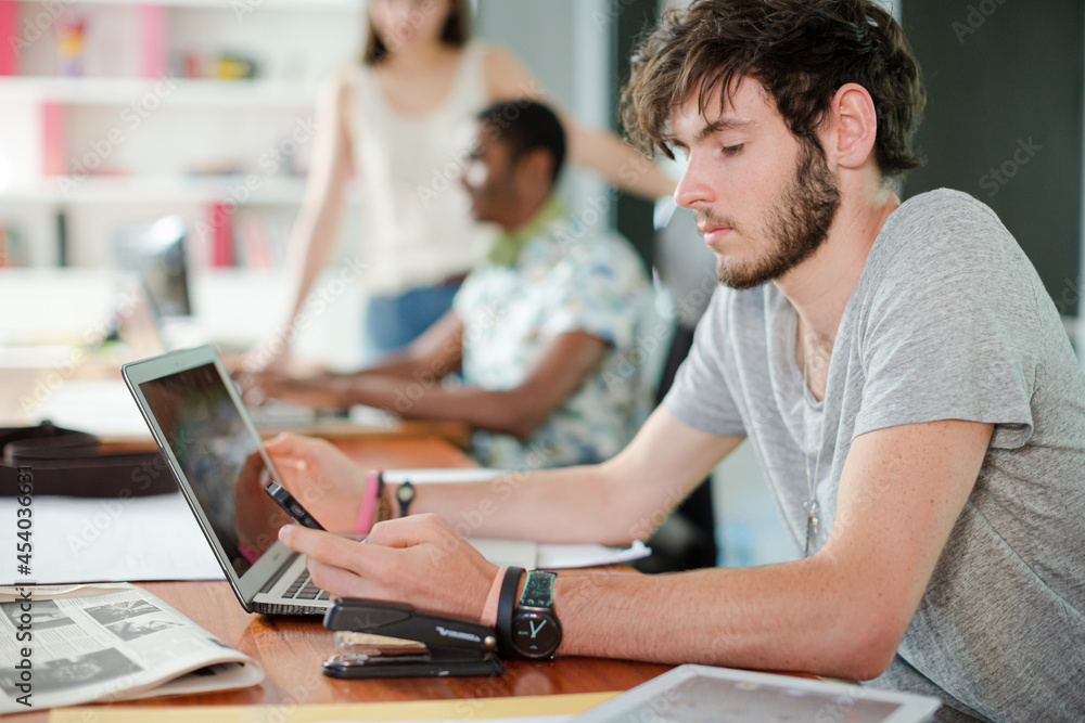 Man working on laptop in office