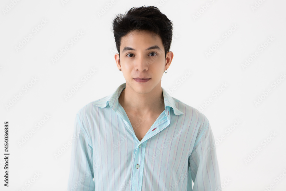 Young and handsome teenage black hair Asian man wearing earrings on white background Young and handsome teenage black hair Asian man wearing earrings on white background