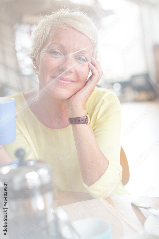 Older woman drinking cup of coffee Older woman drinking cup of coffee