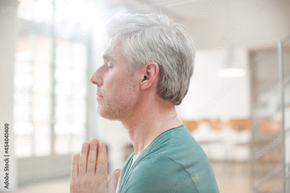 Close up of older man meditating Close up of older man meditating