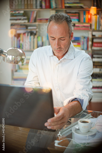Businessman working on laptop in home office