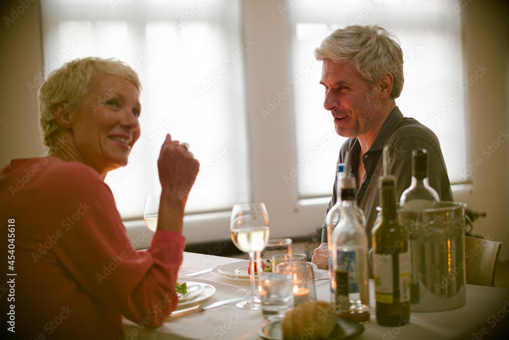 Older romantic couple drinking white wine Older romantic couple drinking white wine