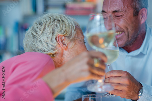 Older friends drinking white wine