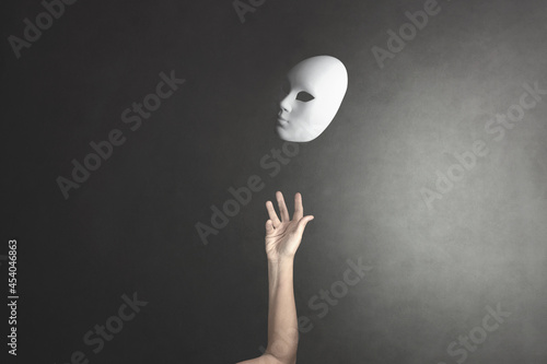 person throws the mask he wore into the air to get rid of it photo