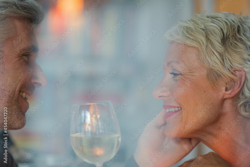 Older romantic couple drinking white wine Older romantic couple drinking white wine