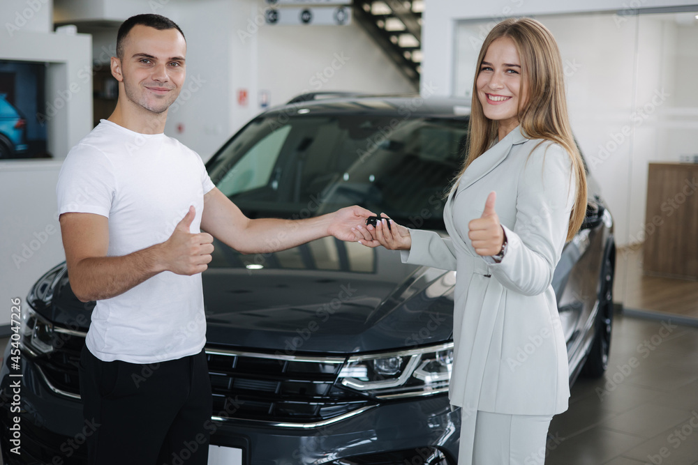 Female sale car for man customer car in car showroom. Good deal