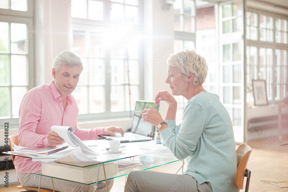 Business people working together at home office desk Business people working together at home office desk