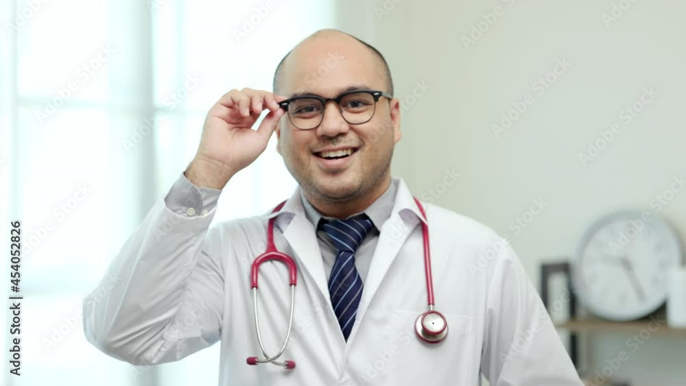 Asian doctor standing posing work from home. Positive male physician with stethoscope looking at camera in hospital background. Healthcare and medical concept.
Asian doctor standing posing work from home. Positive male physician with stethoscope looking at camera in hospital background. Healthcare and medical concept.