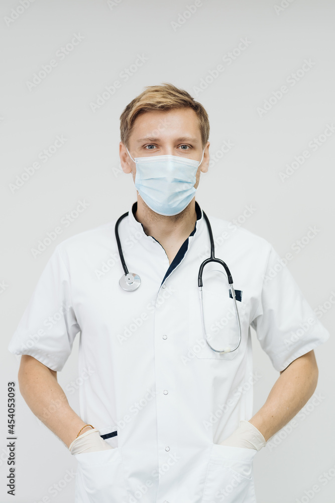 Doctor portrait wearing gloves, Medical Mask and Stethoscope. Medical Concept on white background