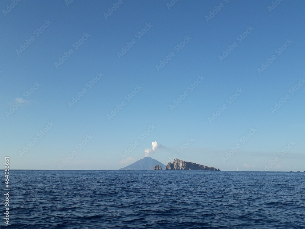 Volcano erupting in the middle of the sea. Aeolian islands, Italy